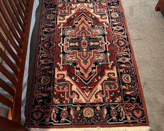 C39 - $60. Wool Throw Rug. Measures 3' x 5'.