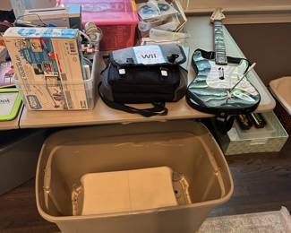 C104 - $225. Wii Bundle. 2 wii systems. Remotes. Games. Guitar. 2 wii fit boards. Untested. Would prefer to sell all together. 6 controllers.
