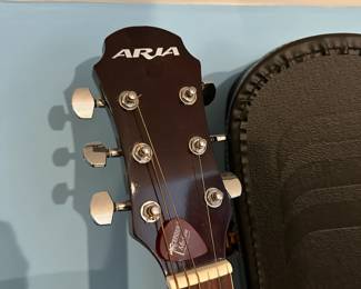 C73 - $125. Aria AW-20N Guitar with Stand and Case. Needs new strings.