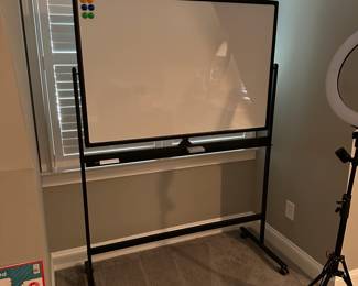 C55 - $75. Tankee Dual Sided Mobile White Board. Magnetic. Measures 49.5" wide x 69" tall.