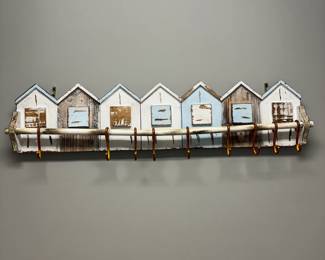 C22 - $25. House wall hanging with hooks. Measures 42" long x 10" tall.