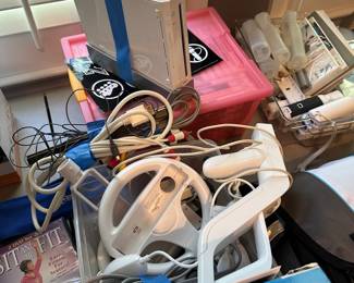 C104 - $225. Wii Bundle. 2 wii systems. Remotes. Games. Guitar. 2 wii fit boards. Untested. Would prefer to sell all together. 6 controllers.