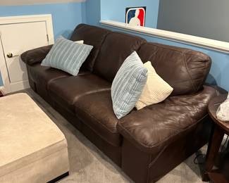 C75 - $500. Dark Brown Leather Couch - Elway Collection by Bassett. Measures 95" long x 42" deep x 34" tall. In very good condition. Right arm shows the most wear. No holes / rips etc. Super clean. ***Please Note - This item is located on the 3rd floor. Please make sure you arrange for help to get this down and out!