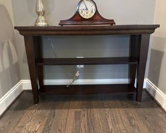 C18 - $125. Bassett Console Table. Measures 41" wide x 16" deep x 30.25" tall. Shows a bit of wear on the edges.