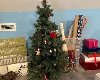 C89 - $25. Artificial Christmas Tree measures 54" tall.