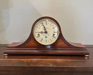 C19 - $60. Howard Miller Mantle Clock. Measures 20.5" wide x 5" deep x 9.5" tall. Battery Powered - not old.