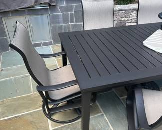 C133 - $300. Outdoor patio set with umbrella & base. 6 rocking chairs. Everything in very good condition.