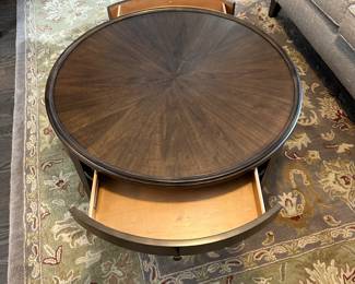 C4 - $250. Bassett Palasides Brindle Round Coffee Table. Measures 36" round x 18" tall. Sunburst veneer pattern using American Walnut. Excellent Condition. 2 drawers.