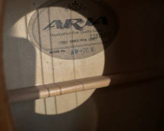 C73 - $125. Aria AW-20N Guitar with Stand and Case. Needs new strings.