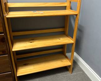 C49 - $35. Single Shelf Unit that folds flat. Measures 28" wide x 11.5" deep x 37" tall.