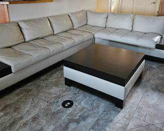 Leather sectional with attached end tables and matching coffee table