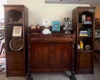 Carved sideboard with bookcase on each side; sold separately 