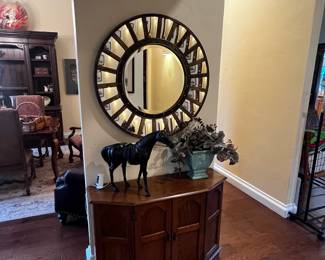 Console table, leather horse and great hall mirror