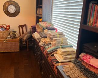 Linens, books, wall clock 