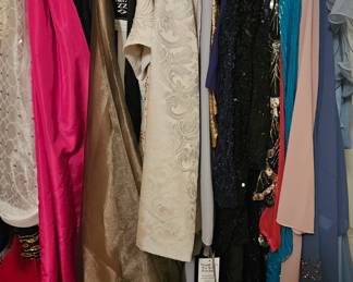 Sequins ball gowns, skirts and tops, some still have tags on them