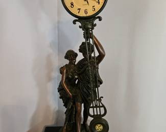Free standing pendulum swing clock