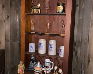 Collection of German steins and Budweiser holiday stein
