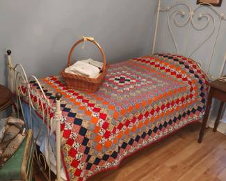 Postage stamp quilt, wrought iron twin bed
