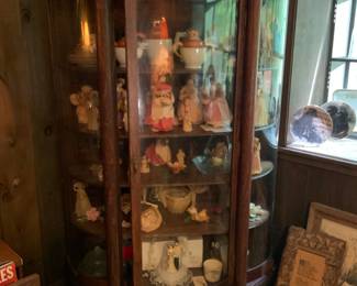 Glass display case full of collectibles 