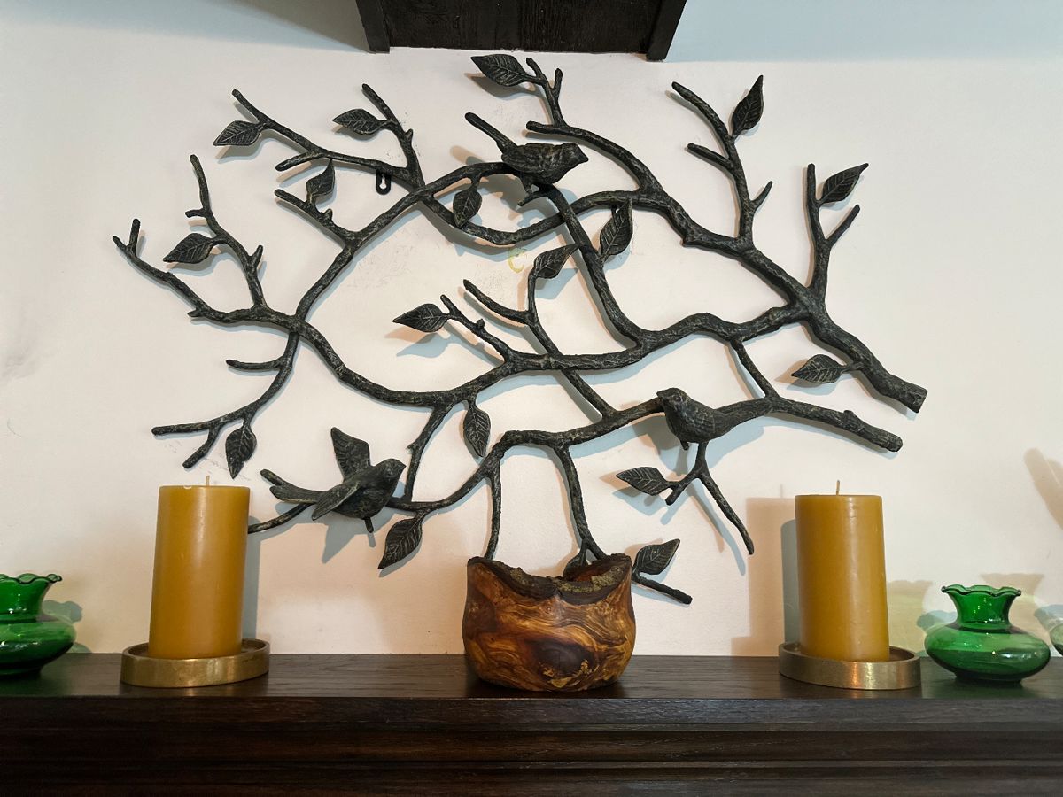 Nature inspired wrought metal wall decor.