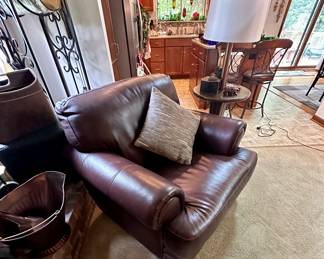 Dark brown leather club chair.