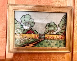 Framed vintage needlework.