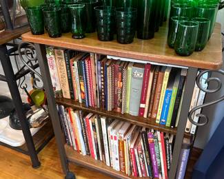 Cookbooks on a counter height table with casters.