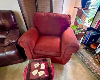 Red upholstered club chair.