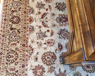 Large, neutral traditional area rug.