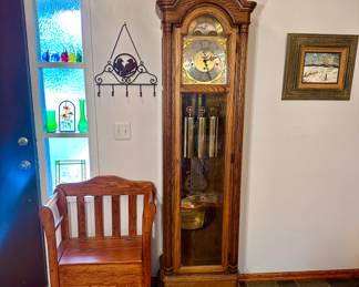 Colonial grandfather clock & oak storage seat .