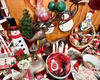 Large stylized metal reindeer candleholder.