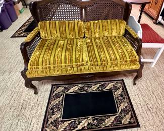 Settee with caned back & sides.