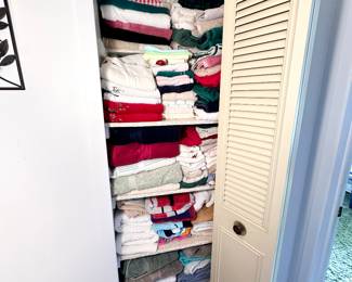 Hall closet overflowing with vintage towels & linens!