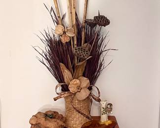 Leaf accented round wall mirror & small storage table.