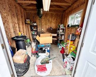 Garden shed filled with useful items.
