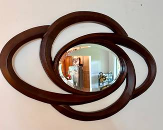 Loop wall mirror, can hang horizontally or vertically.