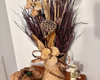 Dried floral arrangement in basket.