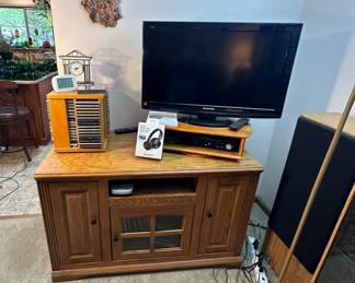 TV stand, cd's & Panasonic TV.