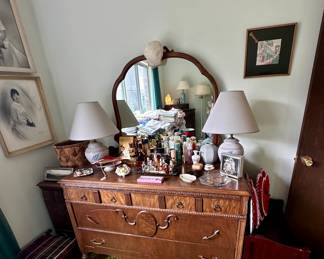 Dresser with mirror & vanity items.