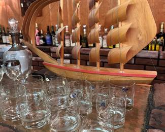 Ship's model and etched rocks glasses.
