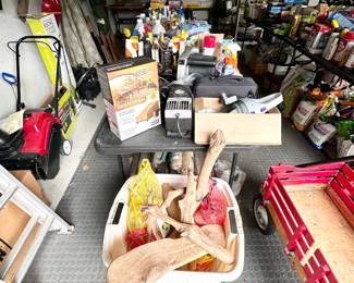We have tables full of garden and cleaning products, as well as a tub full of sea shells and driftwood.