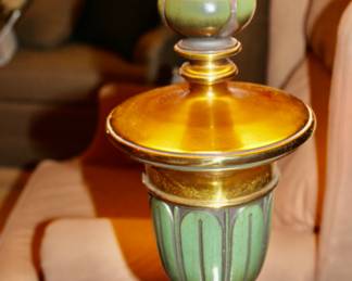 On-off switch is the small gold tip at the bottom of the lamp