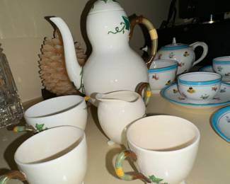 A large collection of tea pots and cups & saucers