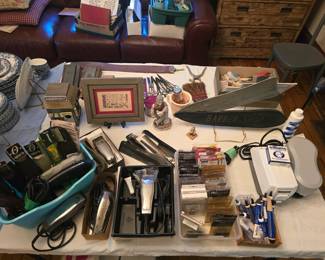 Barber Supplies including high quality electric clippers with lots of replacement blades, maintenance supplies, lathering machines, vintage supplies. Neat wood sign in the shape of an old fashioned razor, that raises and lowers into the sheath. other Barber shop decorations, combs, scissors, razor strop and sharpening stones, disposable towels.