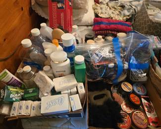 A few boxes of personal hygiene supplies, a box of shoe polish and shoe brushes.