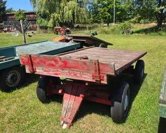 Red Wood Hay Wagon with Metal axels, the tongue needs repair, 10'x6'.