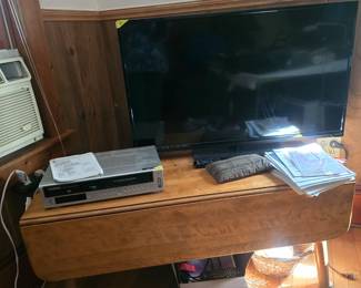42" Flat Screen TV, VHS player, great drop leaf coffee table.