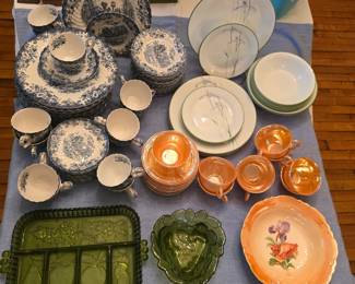 upper left, Johnson Stoneware set, right, Corell Iris set, lower right Orange luster ware cups and saucers, coordinating ceramic bowl, 70's avocado green glass serving pieces.