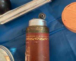 Vintage cigarette lighter with leather case