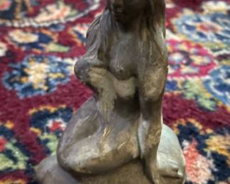 Mermaid on rock sculpture (stone?)